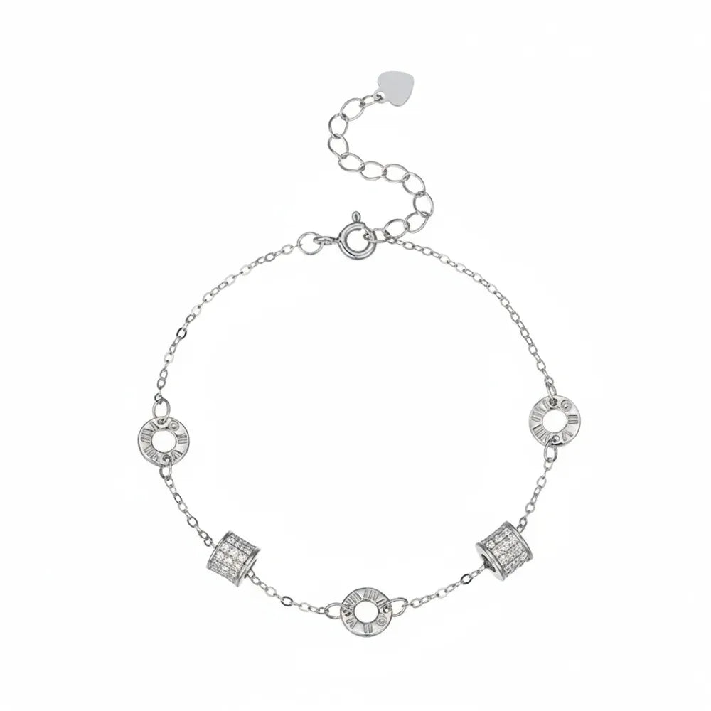 S925 sterling silver chain bracelet featuring rotating roman numeral and pave crystal charms on a white background.