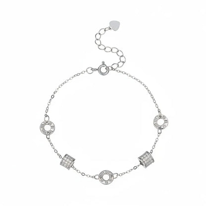 S925 sterling silver chain bracelet featuring rotating roman numeral and pave crystal charms on a white background.
