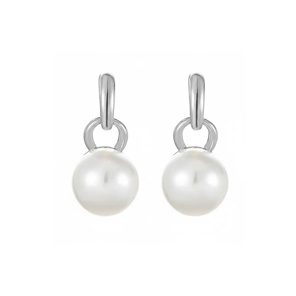 Classic double pearl earrings with vintage milgrain detailing on a white background.
