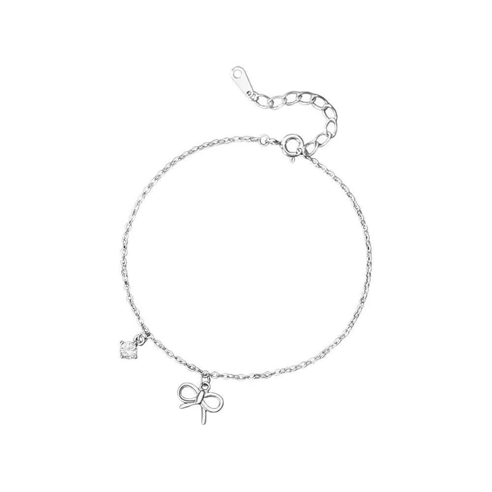 Front view of S999 fine silver bowknot zirconia bracelet, showcasing the dainty design and polished silver finish on a white background.