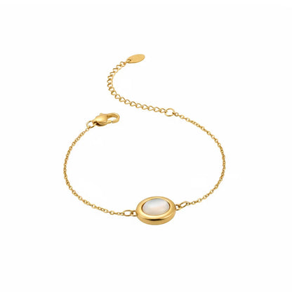 Serena Mother-of-Pearl Bracelet in 18k gold with a round bezel-set charm.

