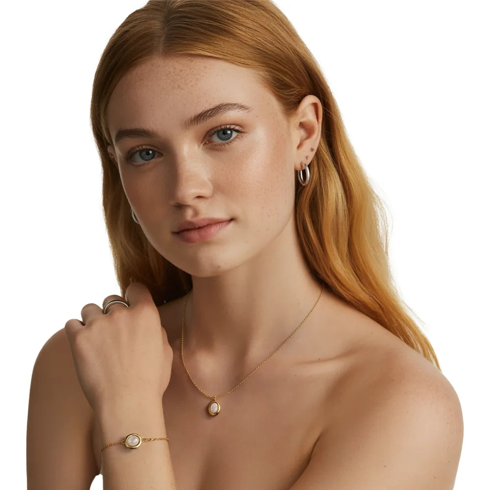 Side profile of a woman showcasing the delicate 18k gold mother-of-pearl necklace and bracelet.