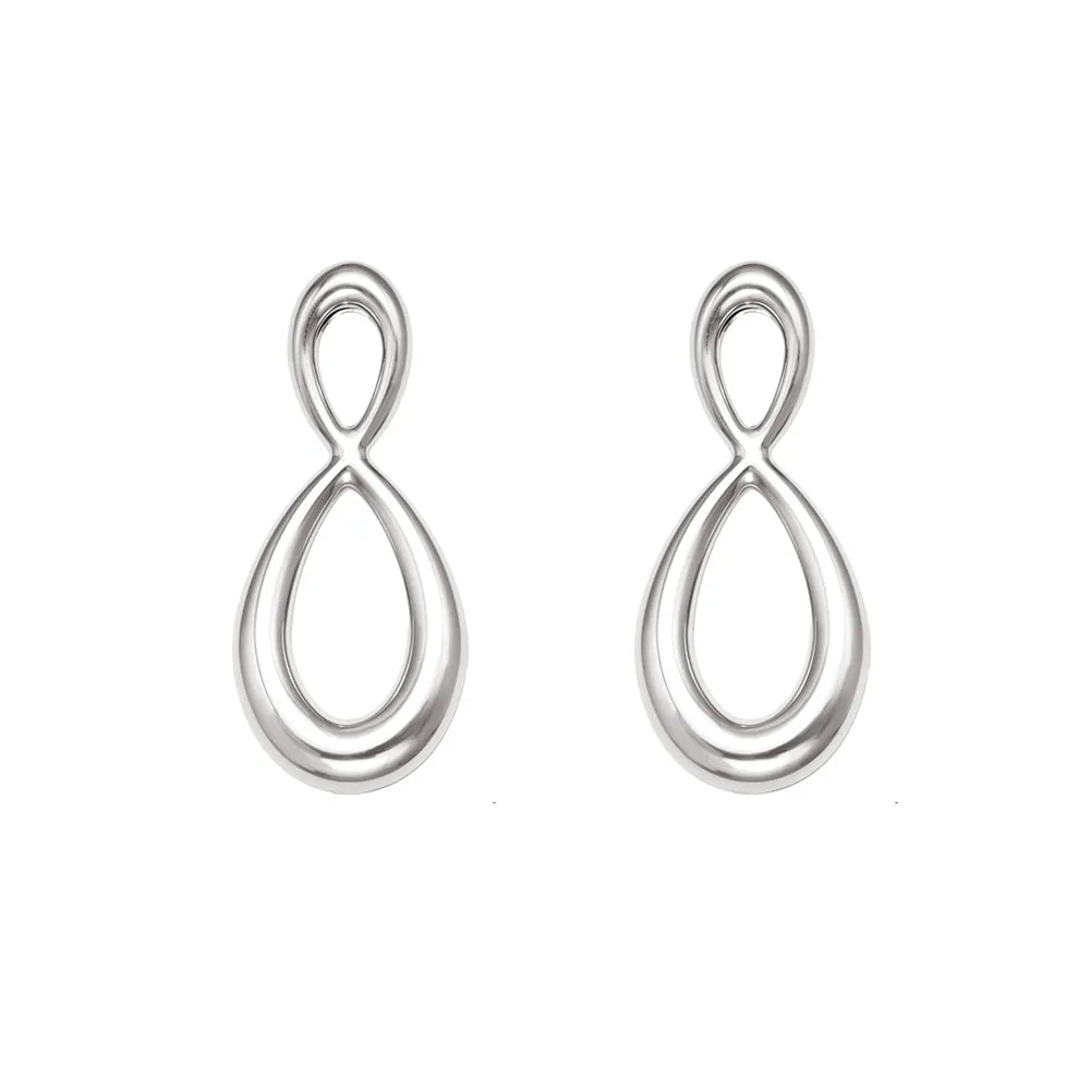 Silver 316L stainless steel earrings with a fluid, liquid metal look in the shape of an infinity loop. Waterproof jewelry.