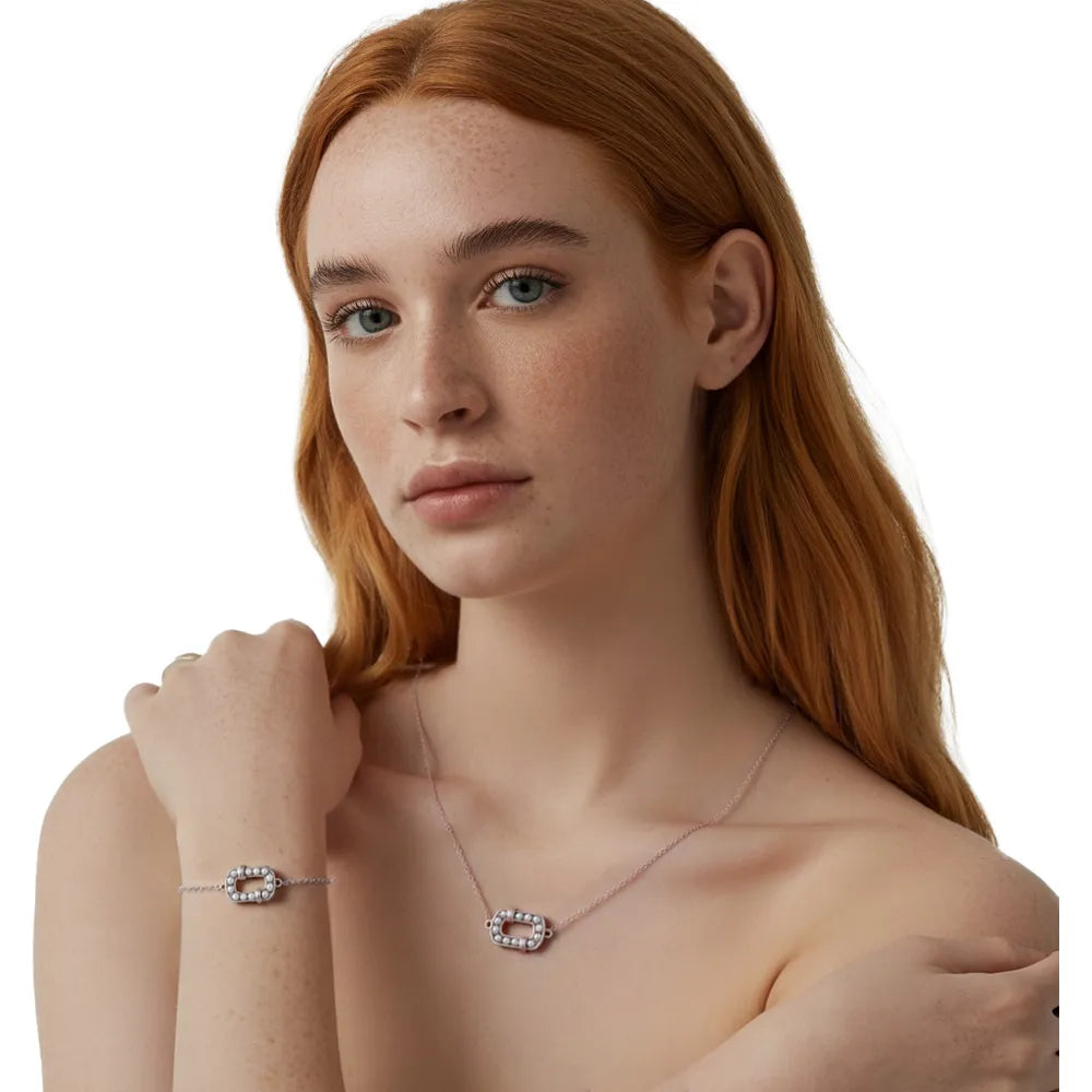 Redhead model showcasing the S925 silver oval pearl necklace and bracelet set.