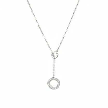 S925 sterling silver lariat necklace with a polished hoop and pave CZ irregular circle pendant.