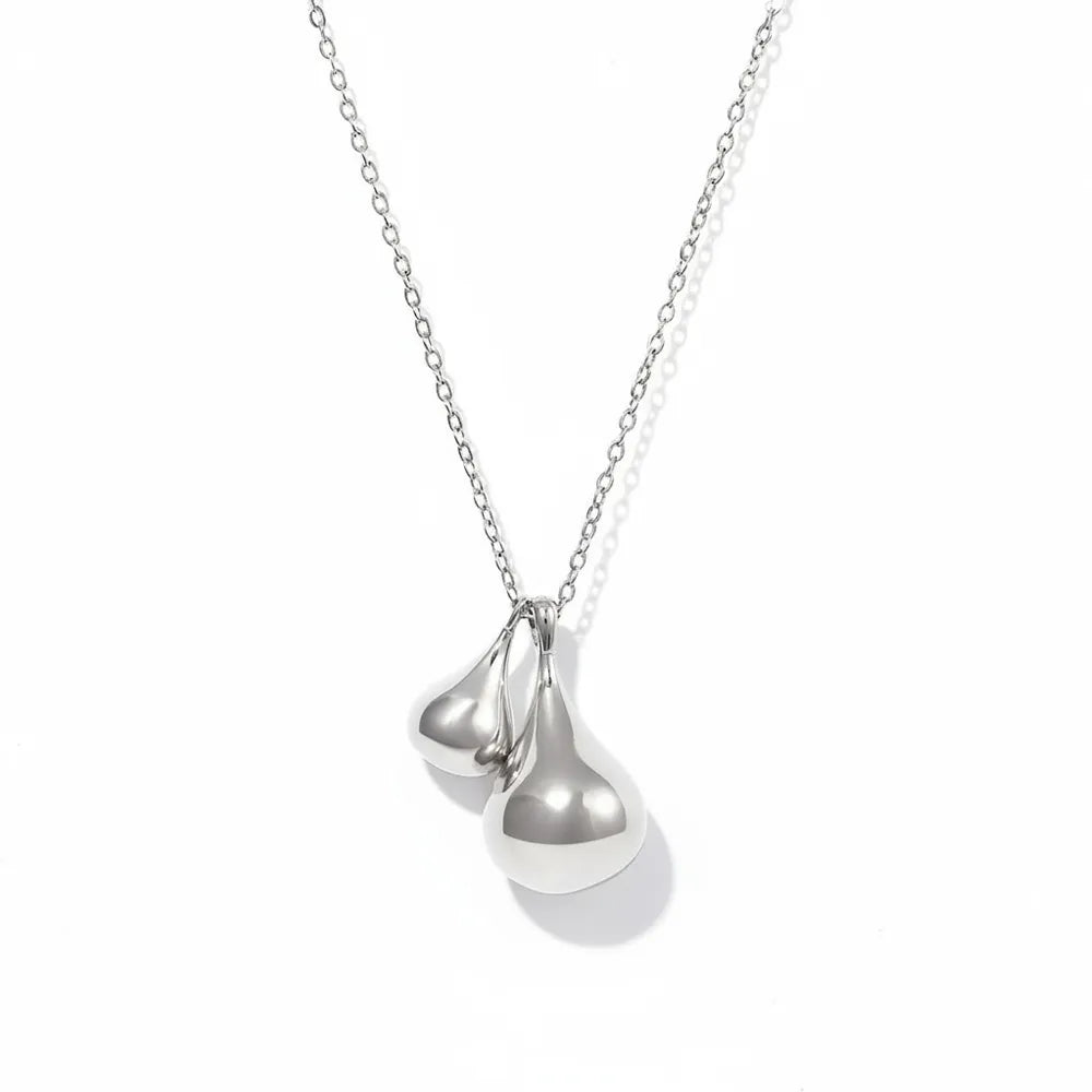 Silver 316L stainless steel necklace with a sculptural double waterdrop design. High polished liquid metal look