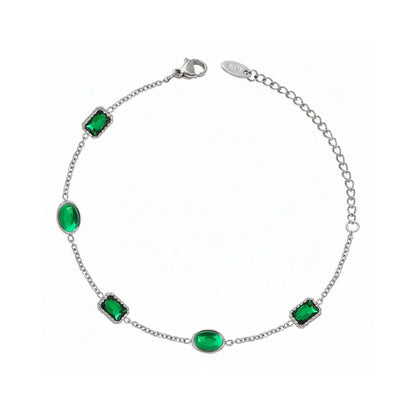Silver 316L stainless steel bracelet set with vibrant green cubic zirconia crystals. Waterproof and tarnish-free jewelry.