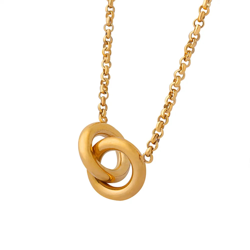 The Thea Interlocking Pendant, featuring one pavé zirconia ring and one polished ring in 18k gold plate.