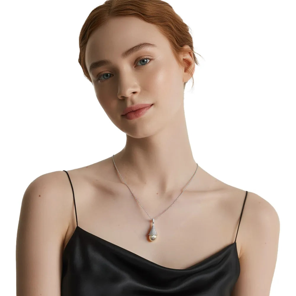 Close-up of the sparkling pave tower and pearl necklace on a model