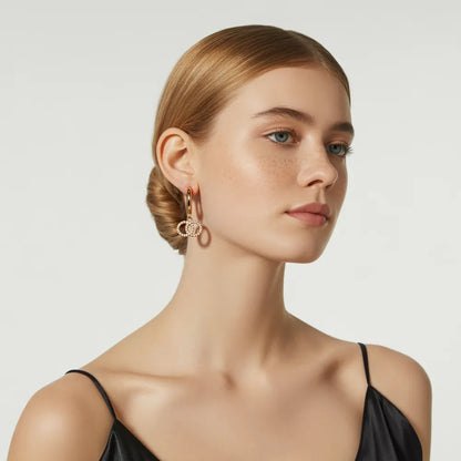 Woman showcasing the chic, modern look of the gold double ring hoop earrings